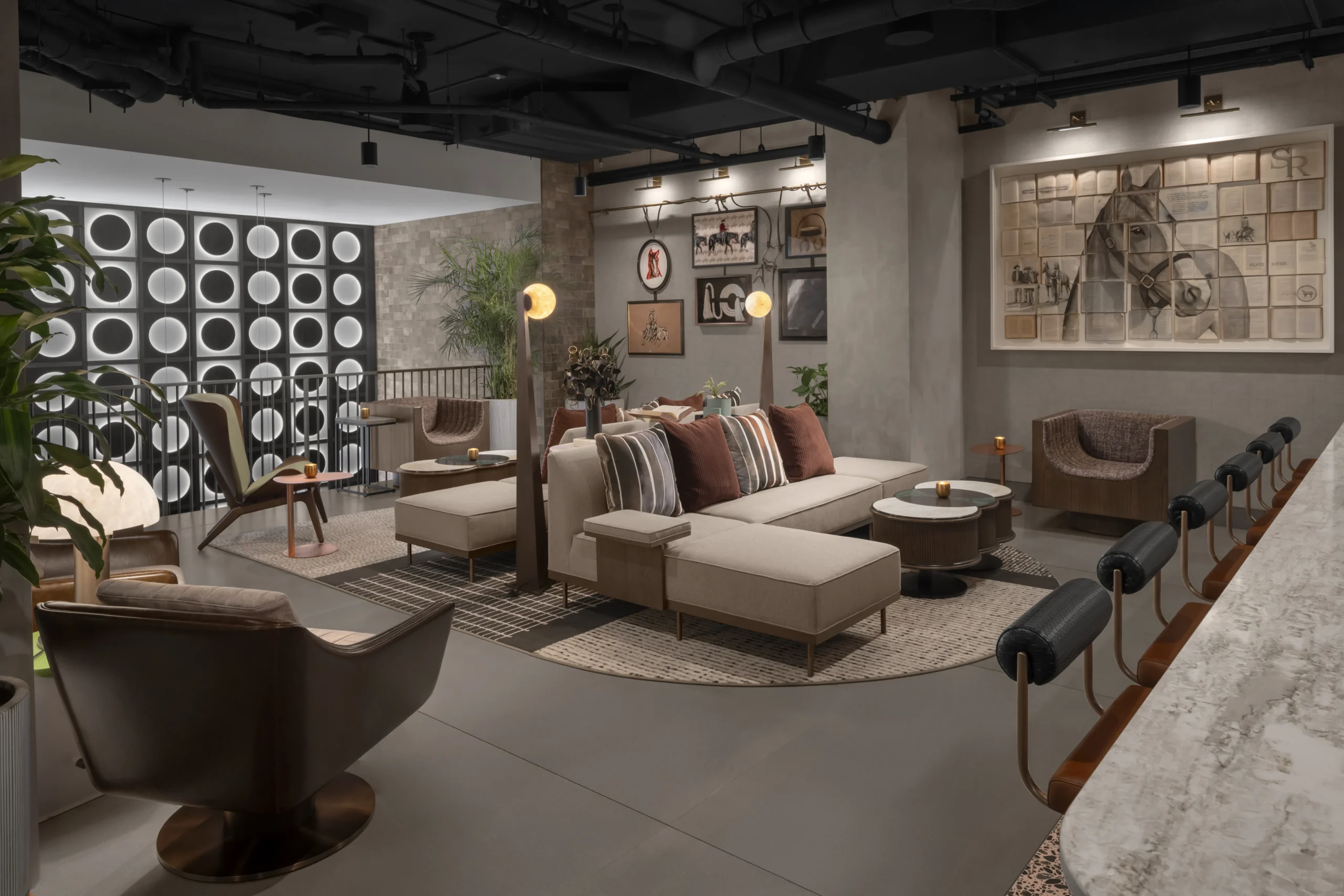 Wild Muse interior at Motto Nashville featuring curated artwork, floor seating, layered textures, and hospitality design supporting guest experience and storytelling