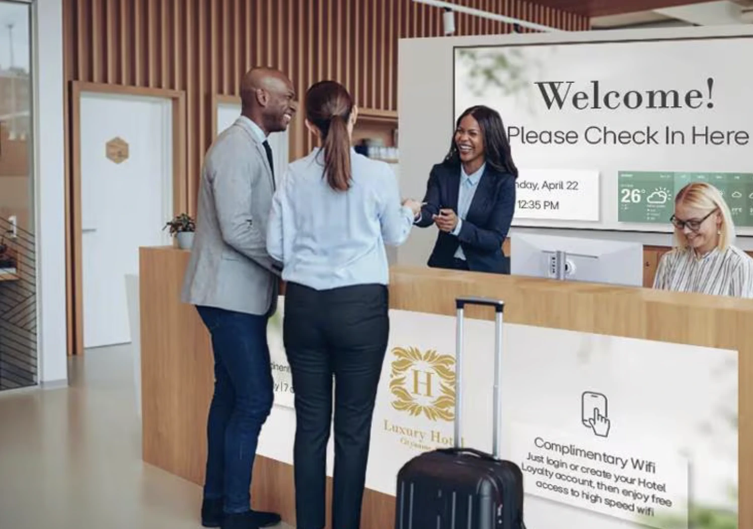 Hotel check-in desk featuring LG hospitality display solutions supporting guest communication, wayfinding, and connected digital experiences