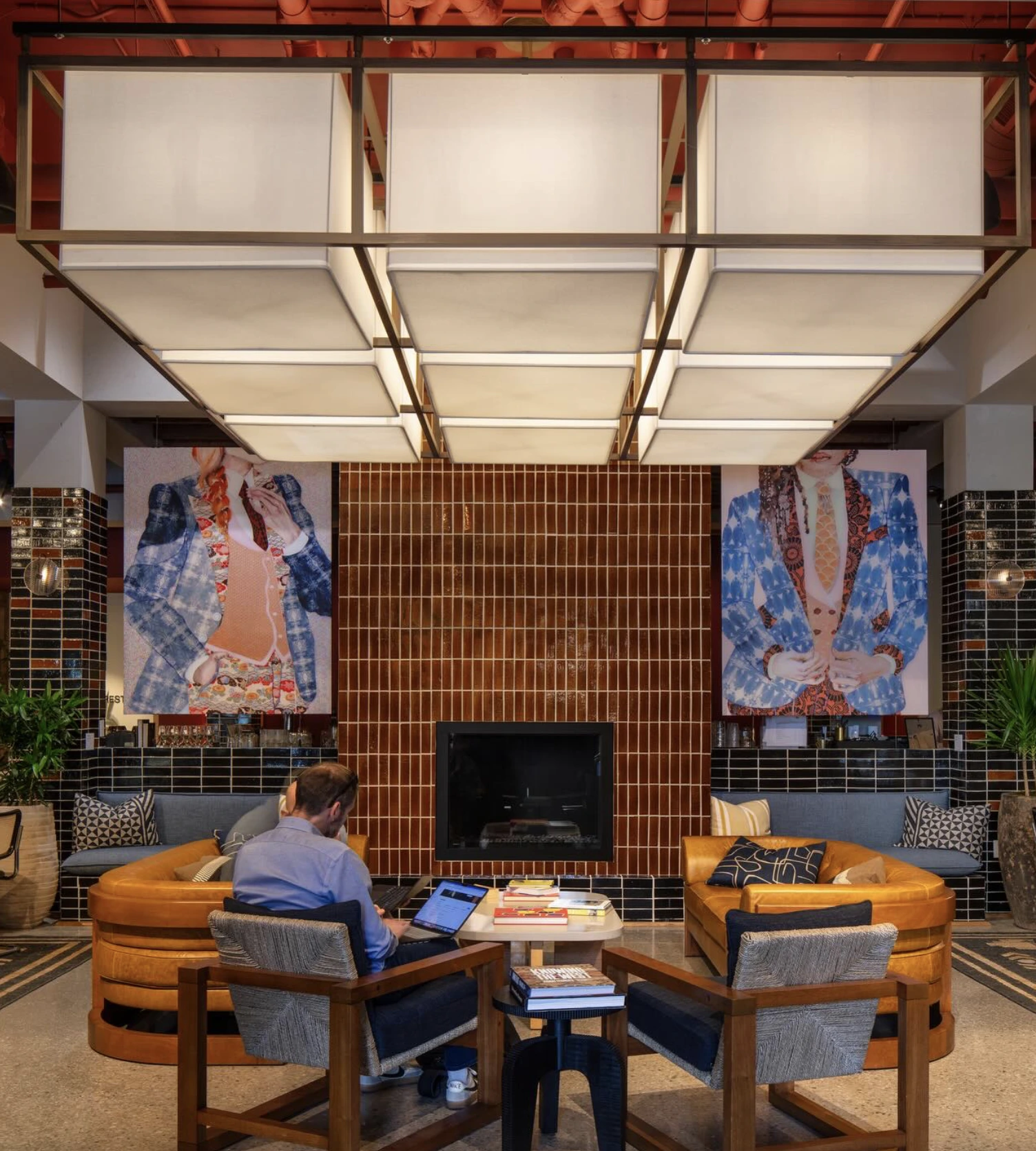 Hospitality lobby featuring custom architectural lighting designed to enhance atmosphere, guest experience, and visual identity.