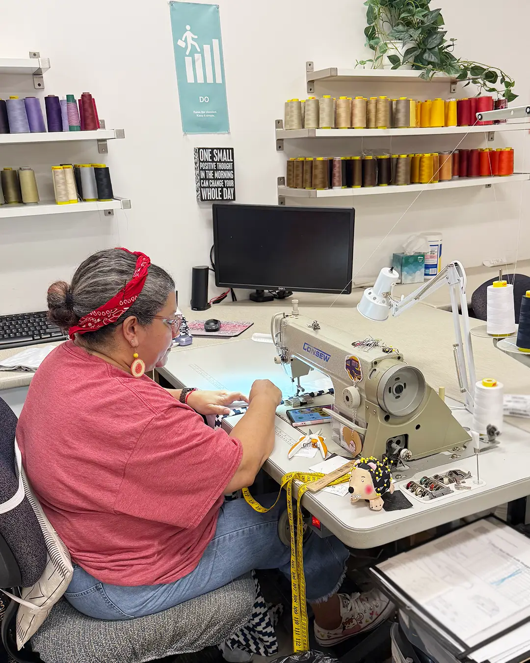 A Valley Forge Fabrics employee working with decorative fabrics that create a refined guest experience.