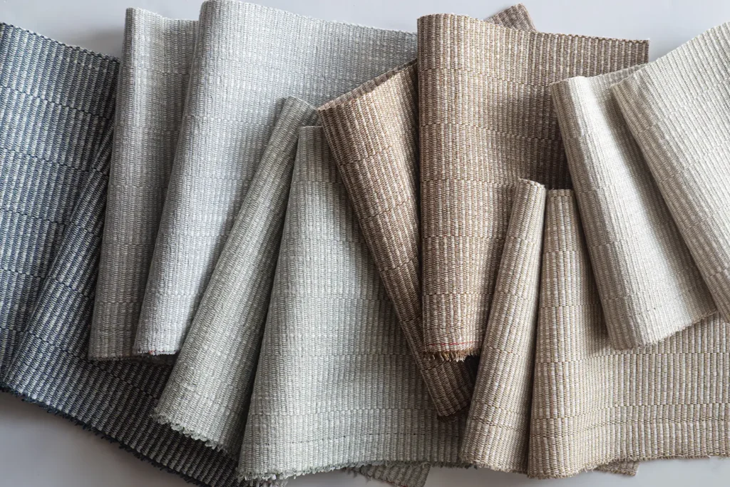 Hospitality textile sample board featuring woven fabric selections used during interior design, specification, and procurement planning for hotel projects.