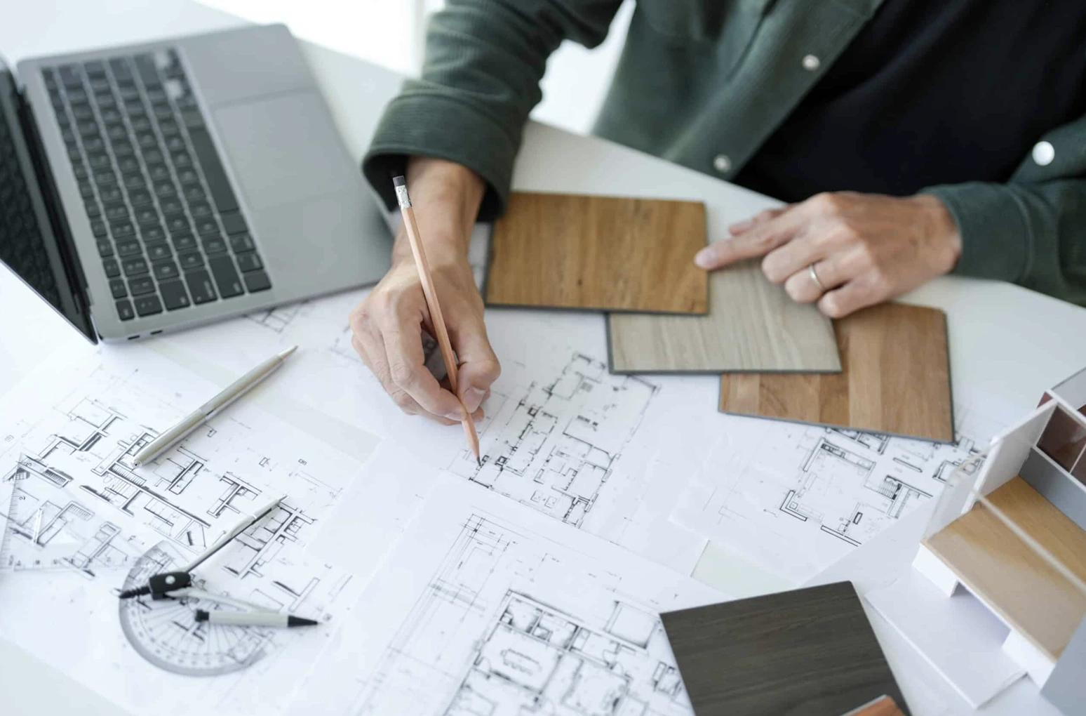 Hotel floor plans and material samples reviewed during design development to refine hospitality preliminary budgeting assumptions and FF&E specifications